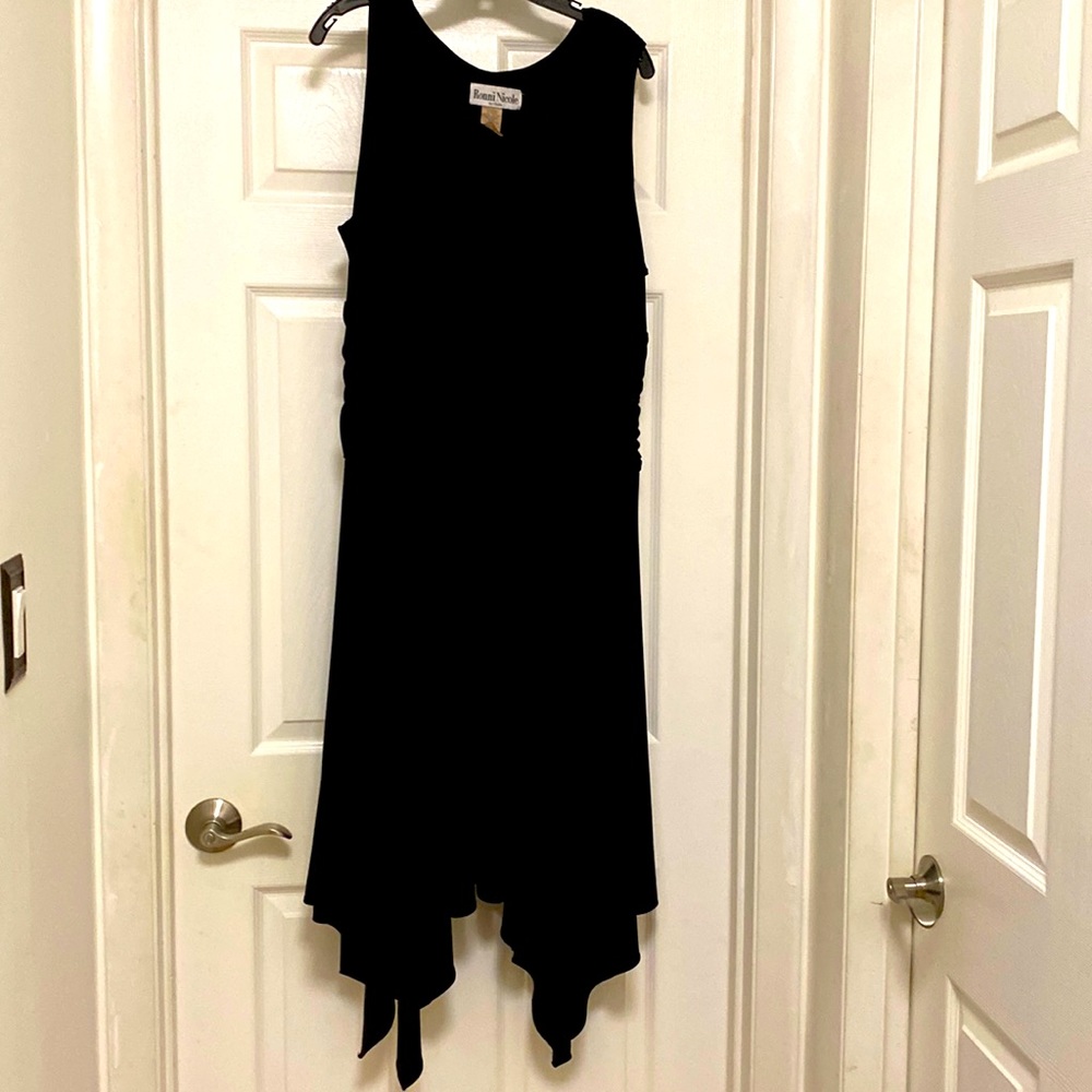 Elegant black dress with asymmetrical hem